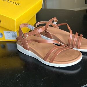 New in box Strive sandal.